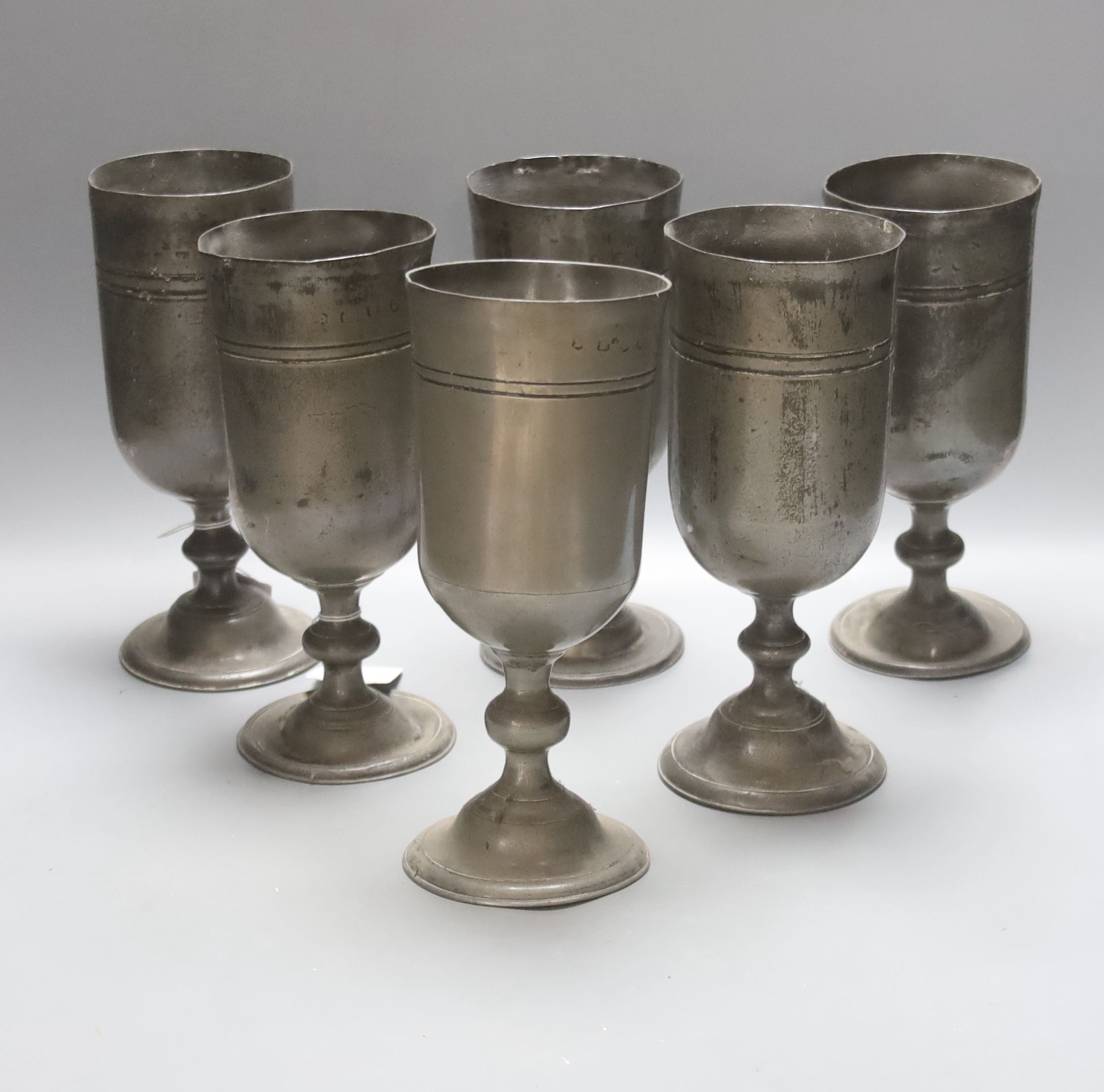 Six various 18th/19th century pewter goblets, worn touchmarks, tallest 12cm